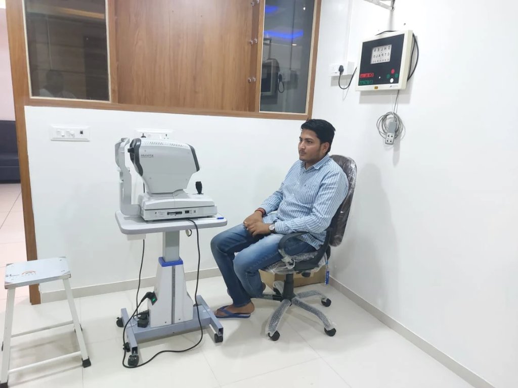 A patient sitting during consultation in the examination suite at Vijay Eye Hospital