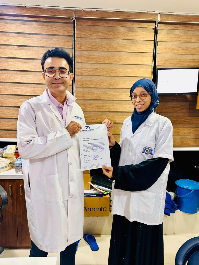 Clinical intern receiving completion certificate from Dr. Punit Singh
