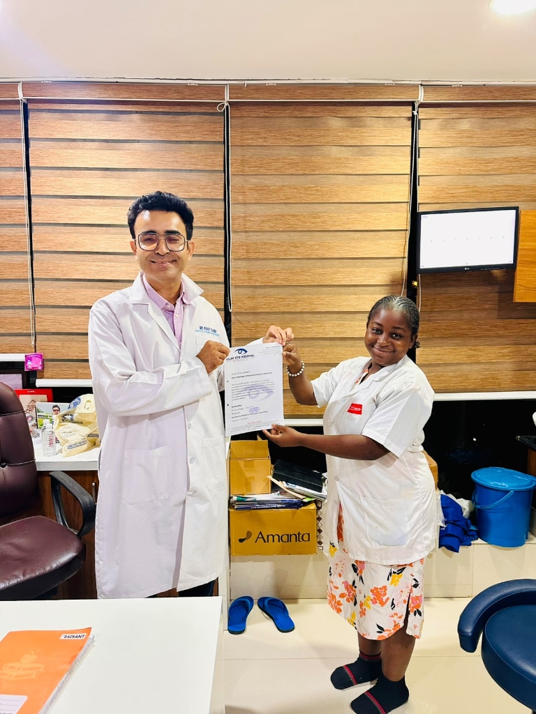 Clinical trainee receiving certification at Vijay Eye Hospital