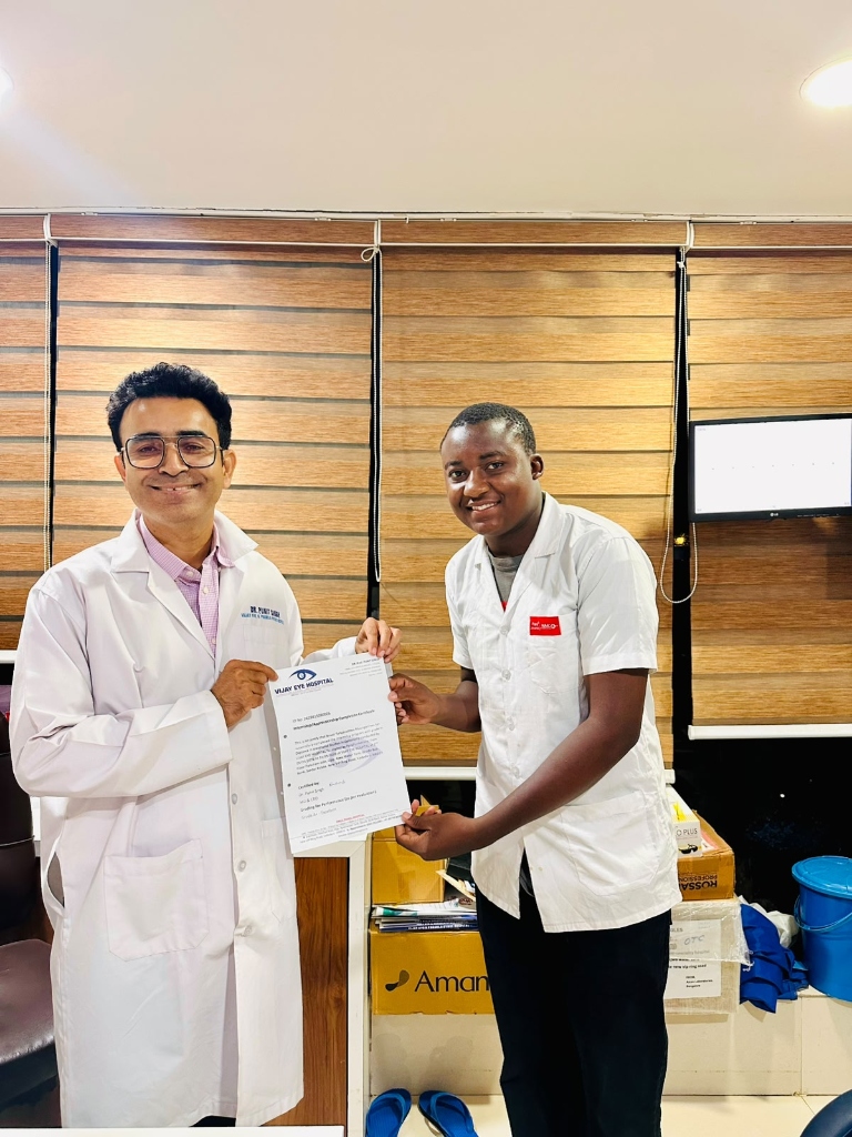 Ophthalmic student receiving training certificate