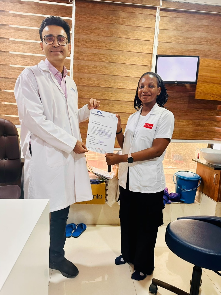 Clinical fellowship intern receiving completion letter from Dr. Punit Singh